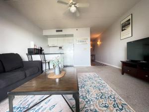 a living room with a couch and a table at Water Street Retreat 05 in Wilmington
