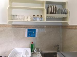 Kuchyň nebo kuchyňský kout v ubytování Acquario Guesthouse + 37 fotografií