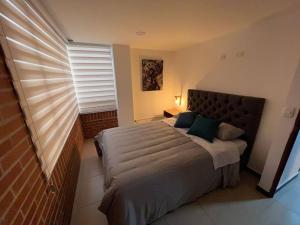 Postel nebo postele na pokoji v ubytování Encantador apartamento cerca al aeropuerto