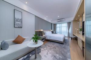 Postel nebo postele na pokoji v ubytování Somerset Haizhu Centre Guangzhou + 37 fotografií