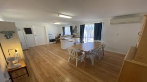 a kitchen and dining room with a table and chairs at Blue Marlin in Jurien Bay