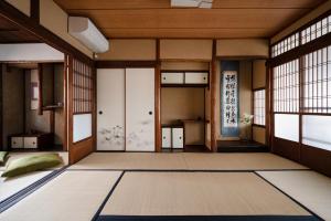 a japanese room with doors and windows at Third&Place Kyoto_ShijoOmiya/四条大宮 in Kyoto