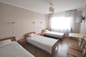 Postel nebo postele na pokoji v ubytování Apartamenti Jēkabpilī