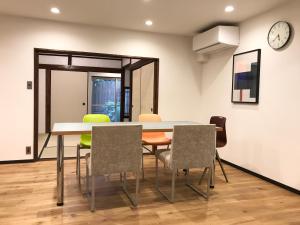 a dining room with a table and chairs at Third&Place Kyoto_ShijoOmiya/四条大宮 in Kyoto +37 photos