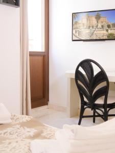 Postel nebo postele na pokoji v ubytování Oidu - Cagliari Suites