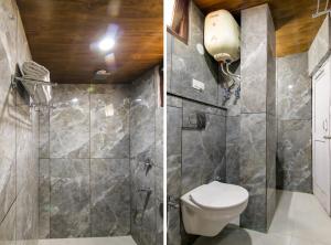 a bathroom with a shower with a toilet and a sink at MHA hotels MOORANG mall manali in Manāli +19 photos