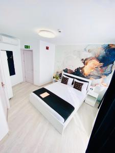 Postel nebo postele na pokoji v ubytování IANIS Rooms