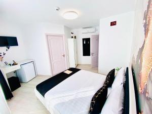 Postel nebo postele na pokoji v ubytování IANIS Rooms