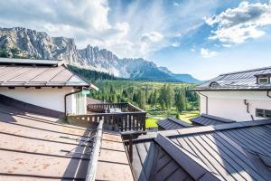 a view of the mountains from the balcony of a house at [LAGO DI CAREZZA] Dolomiti Vista Mozzafiato in Nova Levante