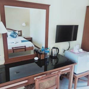 Postel nebo postele na pokoji v ubytování Lalisa Hotel Aonang