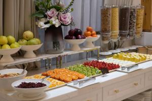 a buffet with different types of fruits and vegetables at LOTTE City Hotels Tashkent Palace in Tashkent