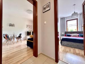 Posteľ alebo postele v izbe v ubytovaní Apartament Klaudia Polanica-Zdrój