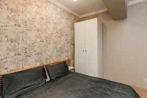 Postel nebo postele na pokoji v ubytování City Center Lev Tolstoi Residence