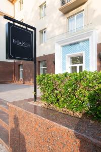 a sign in front of a building at LOTTE City Hotels Tashkent Palace in Tashkent