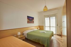 Katil atau katil-katil dalam bilik di Ligure Residence Appartamenti per Vacanze +60 gambar