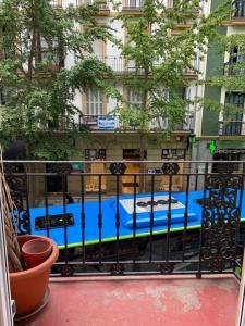 a balcony with a blue pool in front of a building at Olatu Guest House HT LSS00253 in San Sebasti&aacute;n