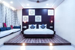 a bedroom with two beds in a room at Hide-In Udaipur - A Lake View Boutique Hotel in Udaipur