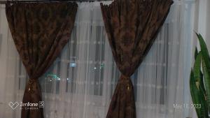a pair of curtains on a window at Studio Leo in Iaşi