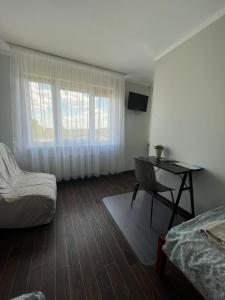 Postel nebo postele na pokoji v ubytování Apartamenti Jēkabpilī