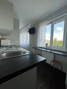 TV a/nebo společenská místnost v ubytování Apartamenti Jēkabpilī