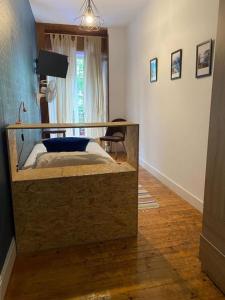 a bedroom with a bed in a room at Olatu Guest House HT LSS00253 in San Sebasti&aacute;n