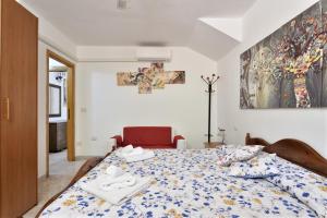 a bedroom with a bed with towels on it at Villa Isabel in Cala Gonone