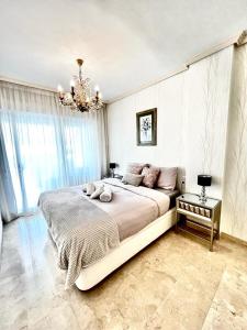מיטה או מיטות בחדר ב-Estrella Albir lujo