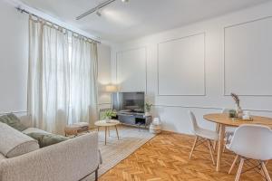 a living room with a couch and a table at Spacious Apartment In Heart Of Zagreb - Happy Rentals in Zagreb