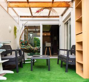 Posedenie v ubytovaní Maison de Ville restylée avec jardin, proche gare