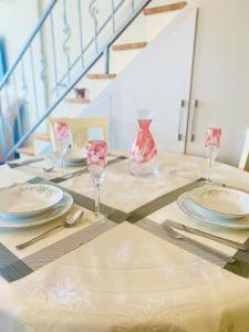 a table with plates and wine glasses on top of it at Port Mansion in Marmaris