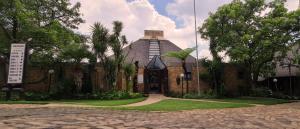 a building with a tower on top of it at Klein Bosveld Guest House in eMalahleni