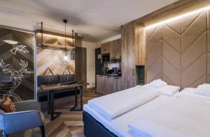 Łóżko lub łóżka w pokoju w obiekcie 24 by AvenidA - Mountain Hotel