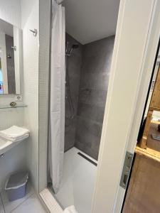 a bathroom with a shower and a sink at Gasthaus Zum Goldenen Hirsch in Schriesheim