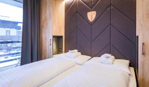 Łóżko lub łóżka w pokoju w obiekcie 24 by AvenidA - Mountain Hotel