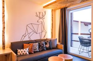 Część wypoczynkowa w obiekcie 24 by AvenidA - Mountain Hotel