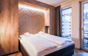 Łóżko lub łóżka w pokoju w obiekcie 24 by AvenidA - Mountain Hotel