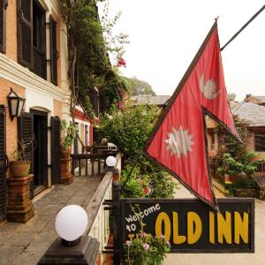 a flag on the side of a old inn at The Old Inn in Bandīpur