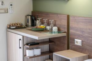 a counter with a plate of food on it at Lafo Rooms in Elafonisi