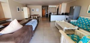 a living room with two beds and a kitchen at La Mer 8 - 6 Sleeper - Overlooking Margate Beach! in Margate