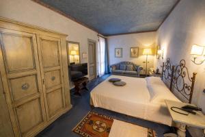 Postel nebo postele na pokoji v ubytování Hotel Boccaccio