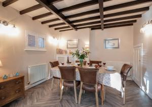 a dining room with a table and chairs at Lezayre in Sandsend