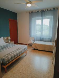 Katil atau katil-katil dalam bilik di Locanda Zona Franca