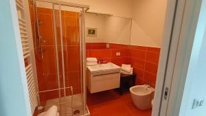 a bathroom with a shower and a sink and a toilet at Villa Le Statue in Florence