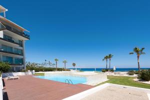 a view of the beach from a house with a swimming pool at Apartment Marina - Beachfront in Protaras