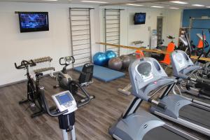 a fitness room with cardio equipment and a gym at Quality Hotel Ostrava City in Ostrava