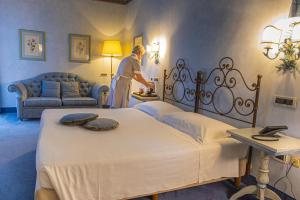 Postel nebo postele na pokoji v ubytování Hotel Boccaccio
