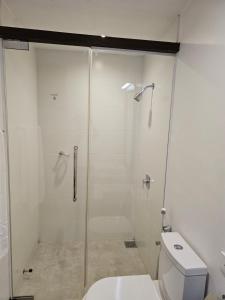 a bathroom with a shower and a toilet at Blue Breeze - Jetwing Select in Negombo