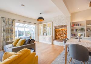 a living room with a couch and a table at Honey Cottage in Richmond