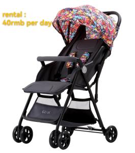 a black baby stroller with an umbrella at Wenjun Courtyard Hotel ---5 mins walk from Tonghuimen metro station, near Tianfu square, close by culture park and Sichuan opera house, English speaking service, local tours in Chengdu