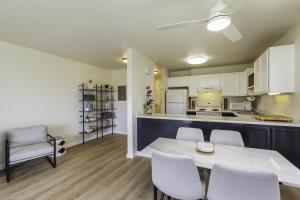 a kitchen and dining room with a table and chairs at Pono Kai H204 condo in Kapaa